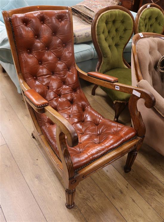 A Victorian buttoned leather scroll armchair D.90cm H.96cm W.54cm